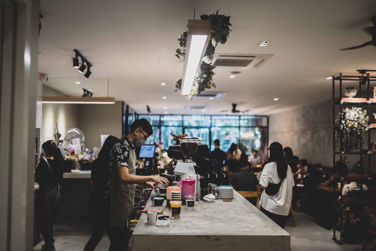 Barista at the Fam Cafe counter